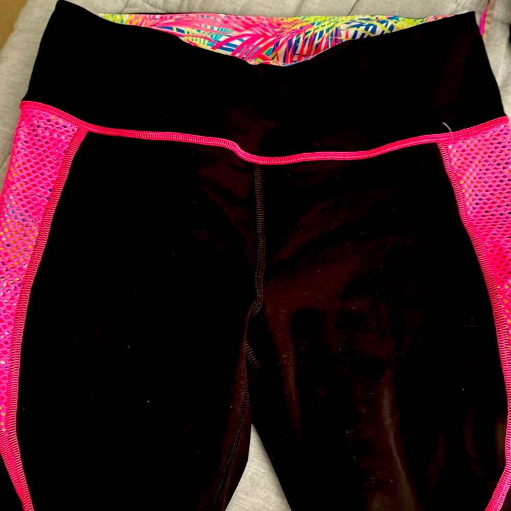 VSX Sport black athletic pant with pink mesh accents.